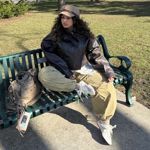 Lifestyle image for @marilyn.iskander styling lace sneakerina on a park bench