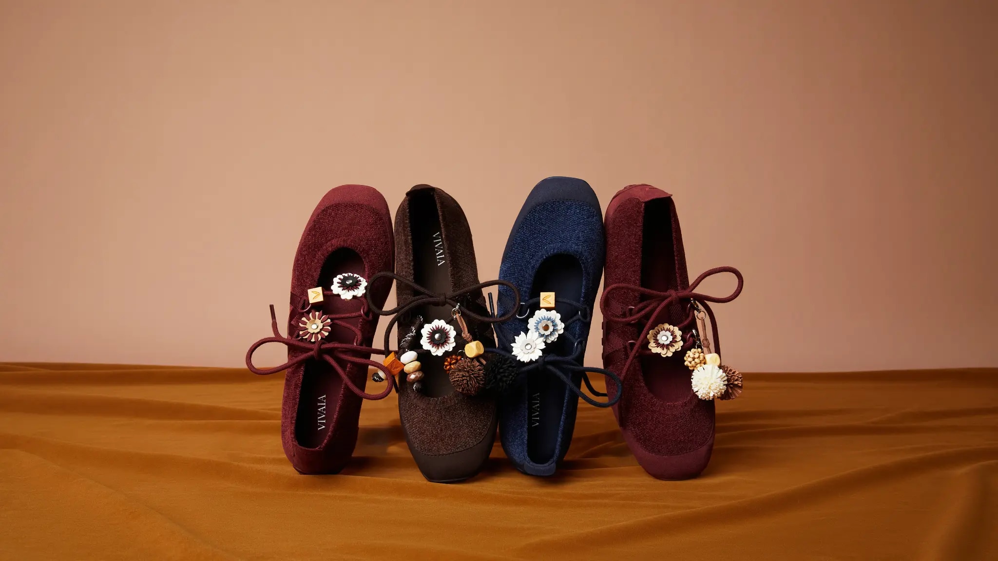 Hybrid Mary Janes collection styled against a warm brown backdrop