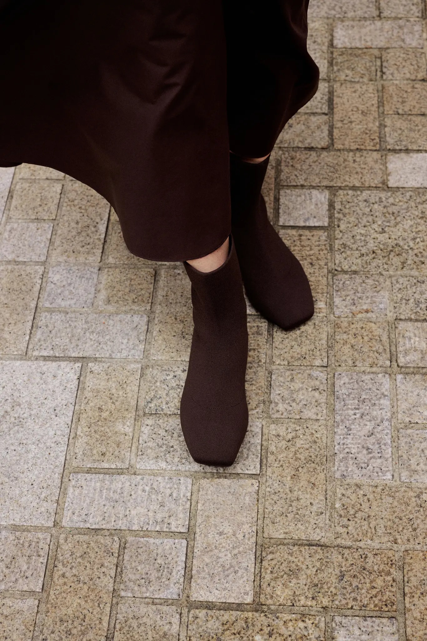 Dark Chocolate square-toe ankle boots on stone pavement