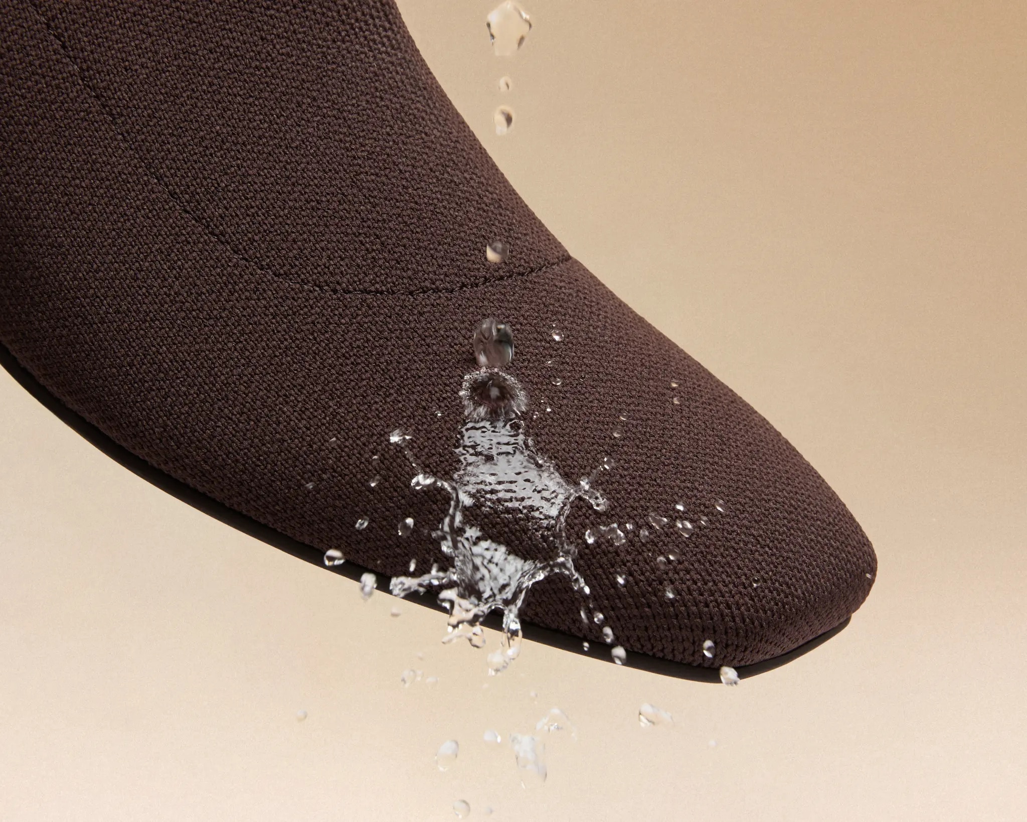 Water beading on the Dark Chocolate knit boot’s water-repellent upper
