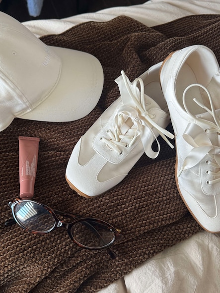 Customer wearing shoes for a polished travel outfit