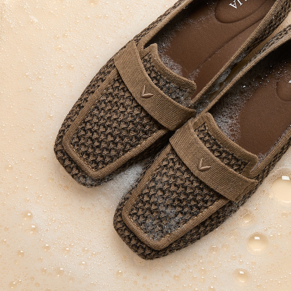 Machine-washable VIVAIA loafers shown in gentle cleansing foam