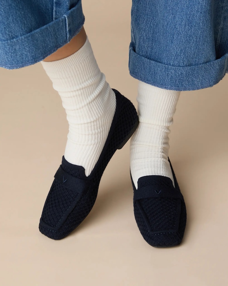 Navy VIVAIA loafers worn with white ribbed socks
