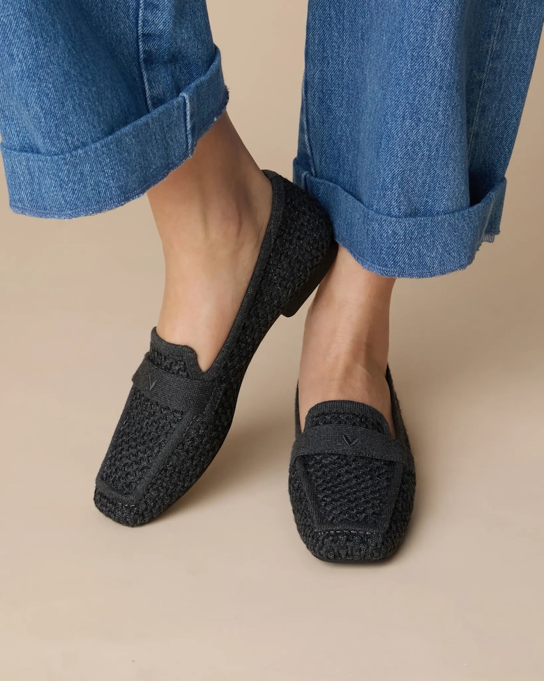 Black and Grey VIVAIA loafers worn with bare ankles