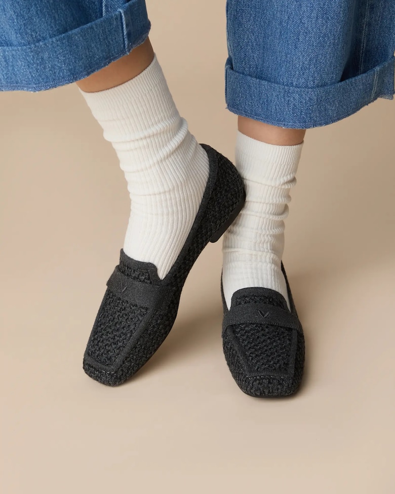 Black and Grey VIVAIA loafers worn with white ribbed socks