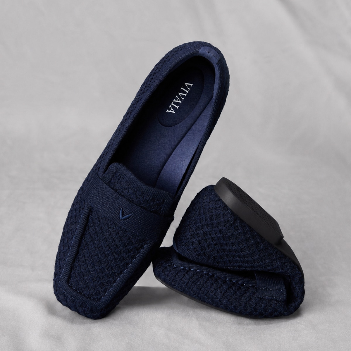 Soft VIVAIA loafers folded for packing