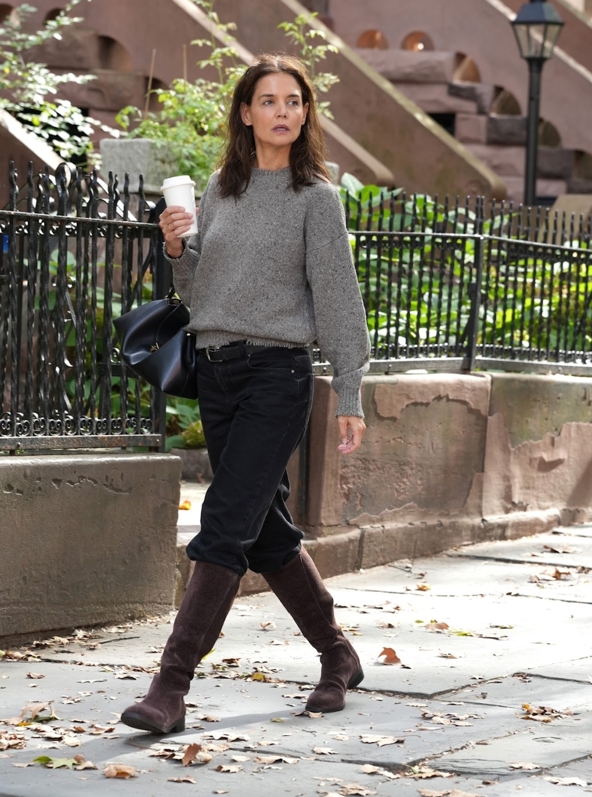Katie Holmes walking in New York City wearing Vivaia Aida boots.