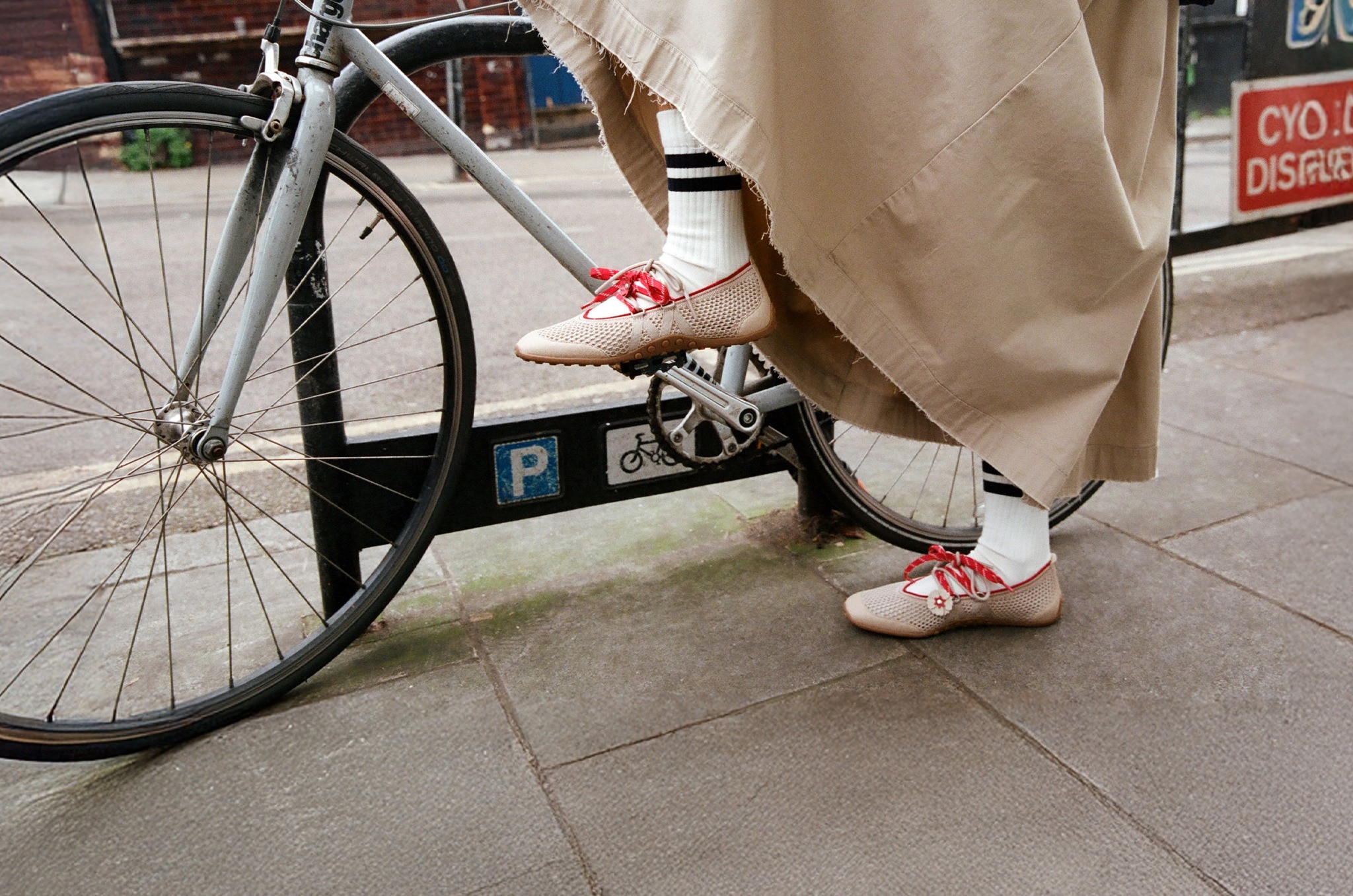 Woman walking in Hybrid Mesh Mary Janes on cobblestone street