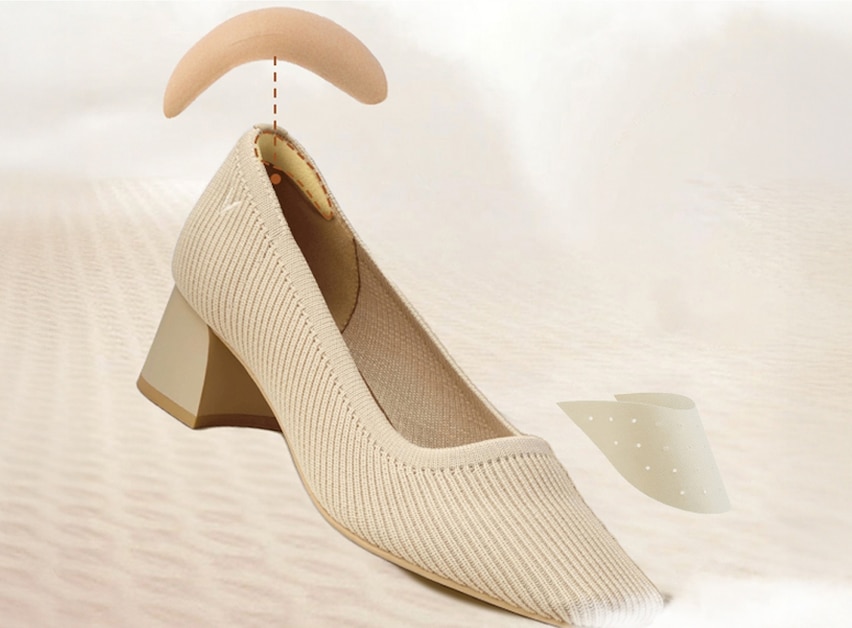 Woman walking confidently in VIVAIA heels on city sidewalk