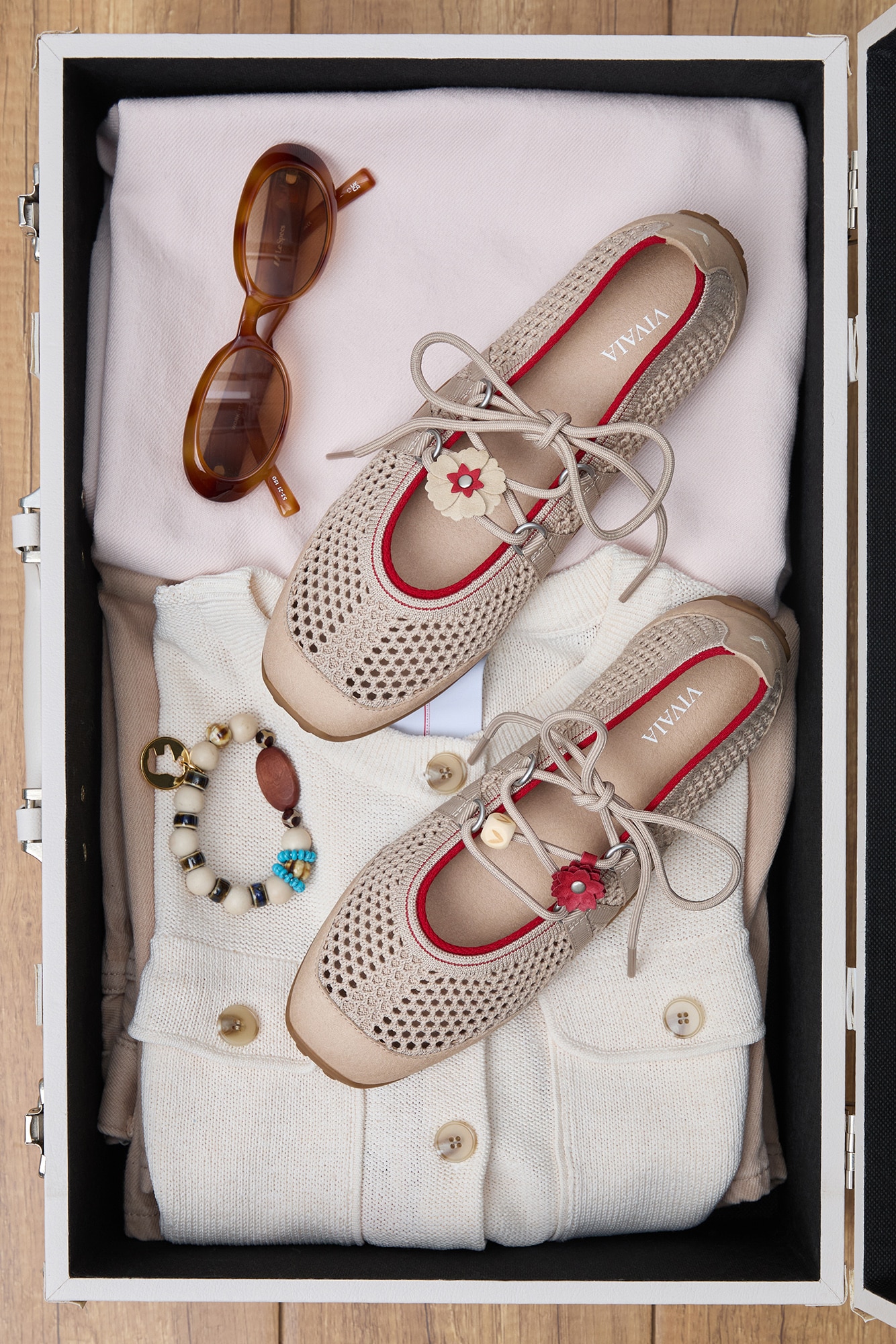 Cecily Almond Mesh in suitcase