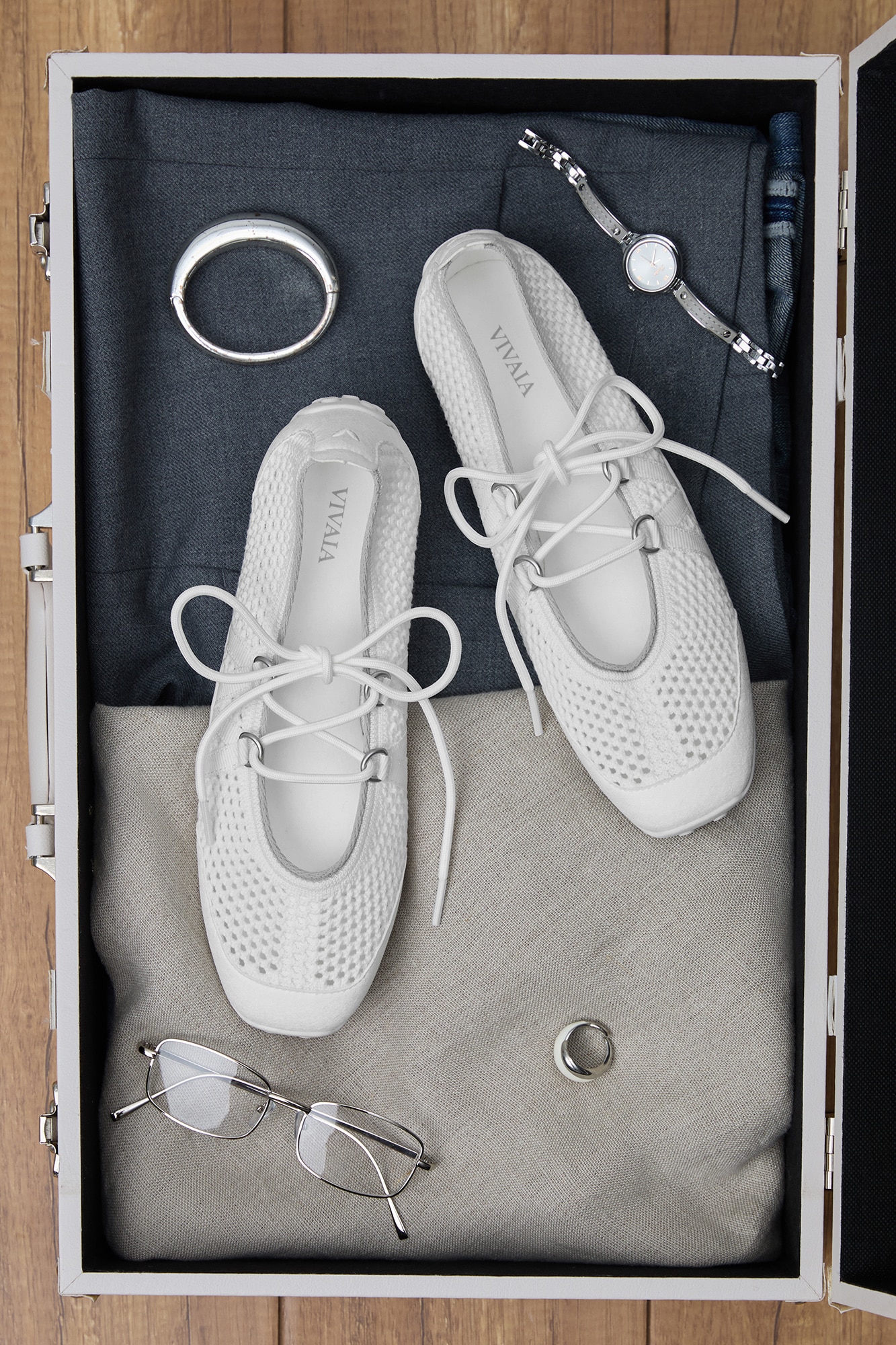 Cecily White Mesh in suitcase