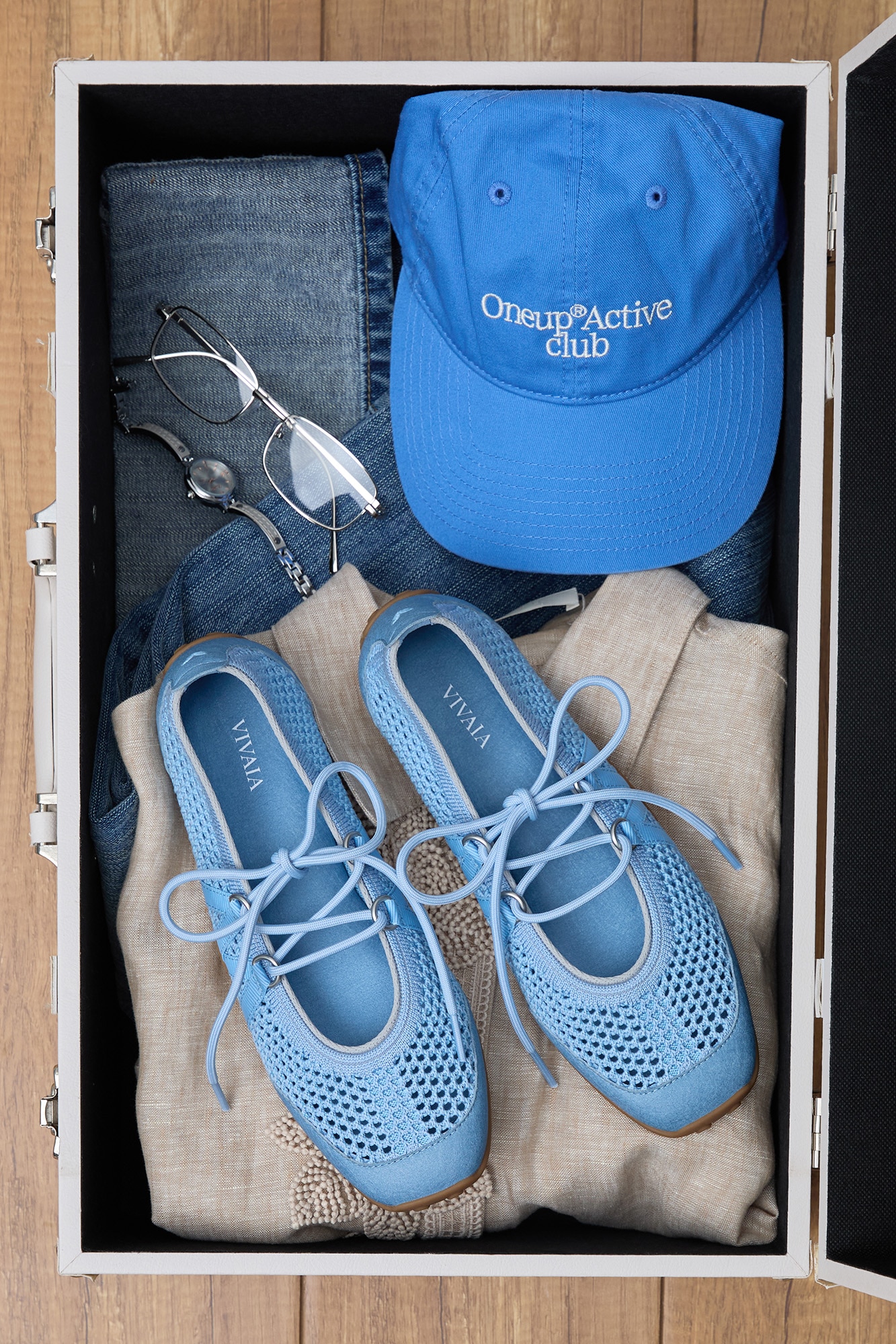 Cecily Smoke Blue in suitcase