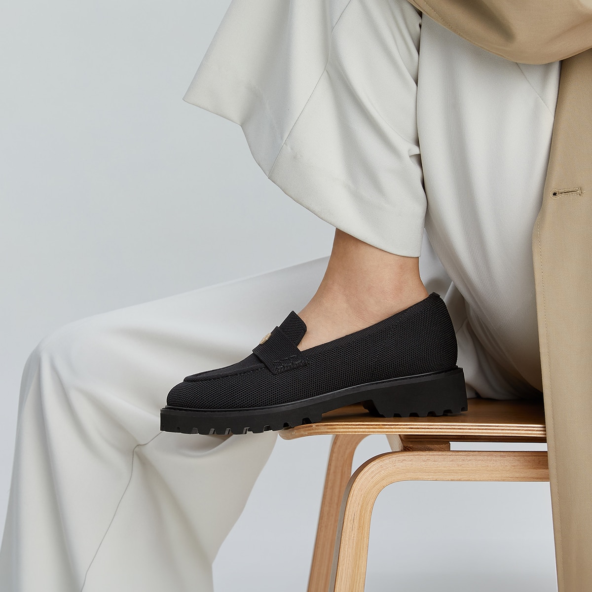 Model wearing VIVAIA Francesca black work loafers with tailored office styling