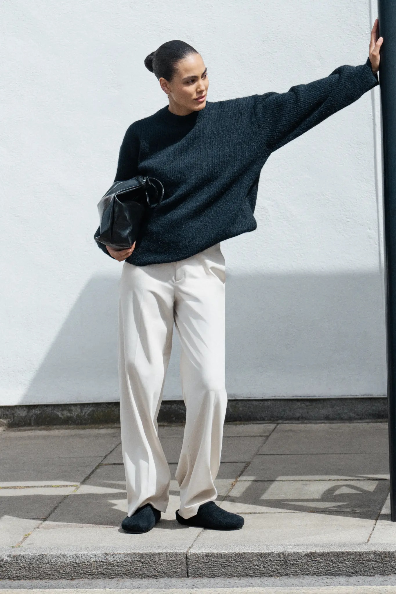 Woman wearing Round-Toe Clog Mules as she steps out