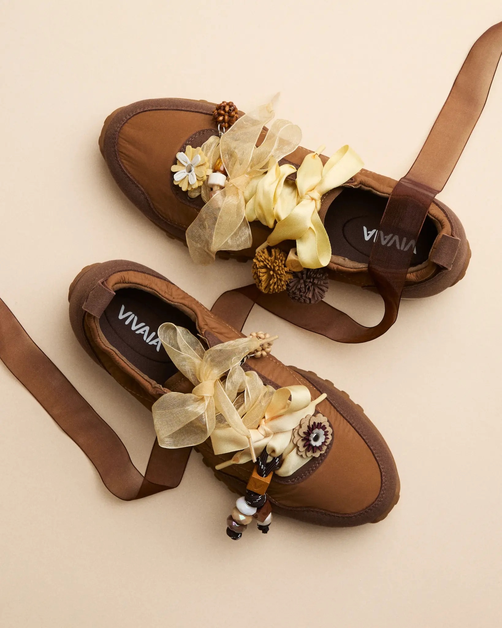 Brown VIVAIA shoes styled with yellow ribbons, flower charms and seasonal details