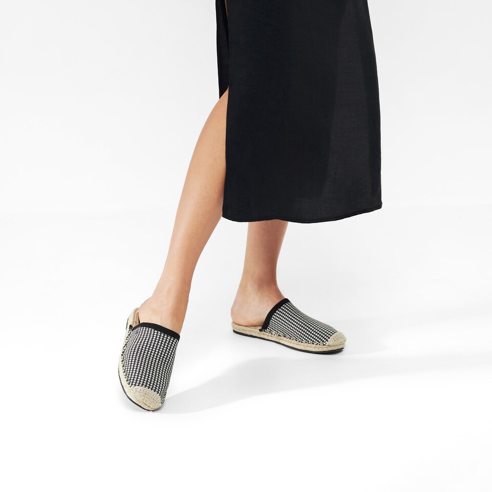 Sherly Round-toe Slides in Ebony Ivory | Women's Sustainable and Stylish Black Shoes | VIVAIA