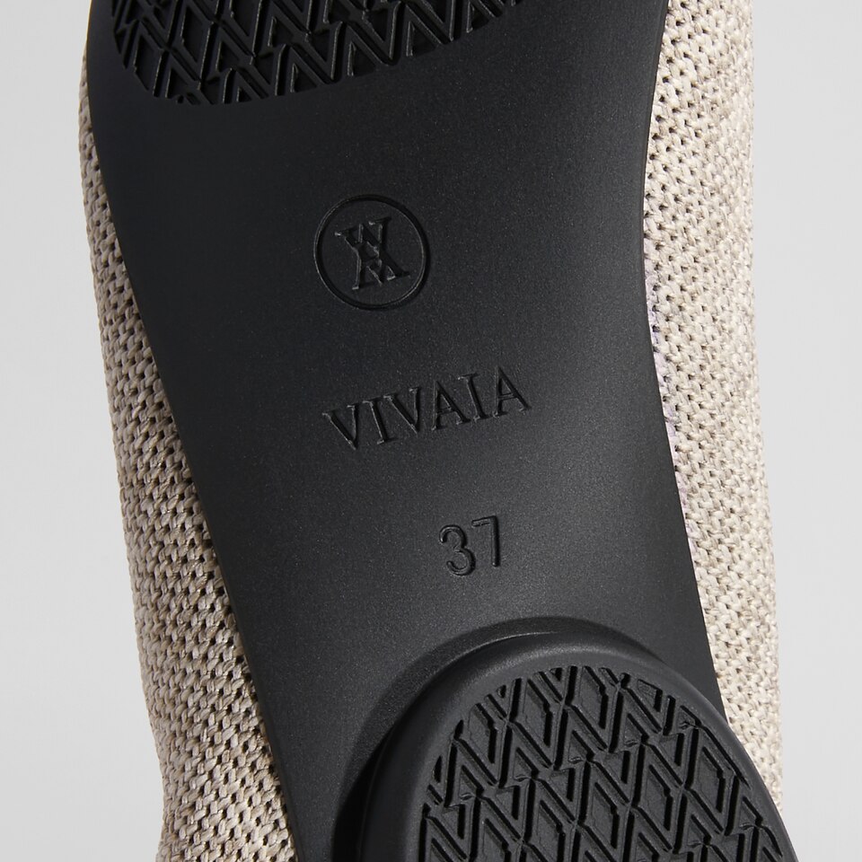 Tamia Beatrice Adjustable Ankle Wrap Round Toe Flats in Oatmilk | VIVAIA